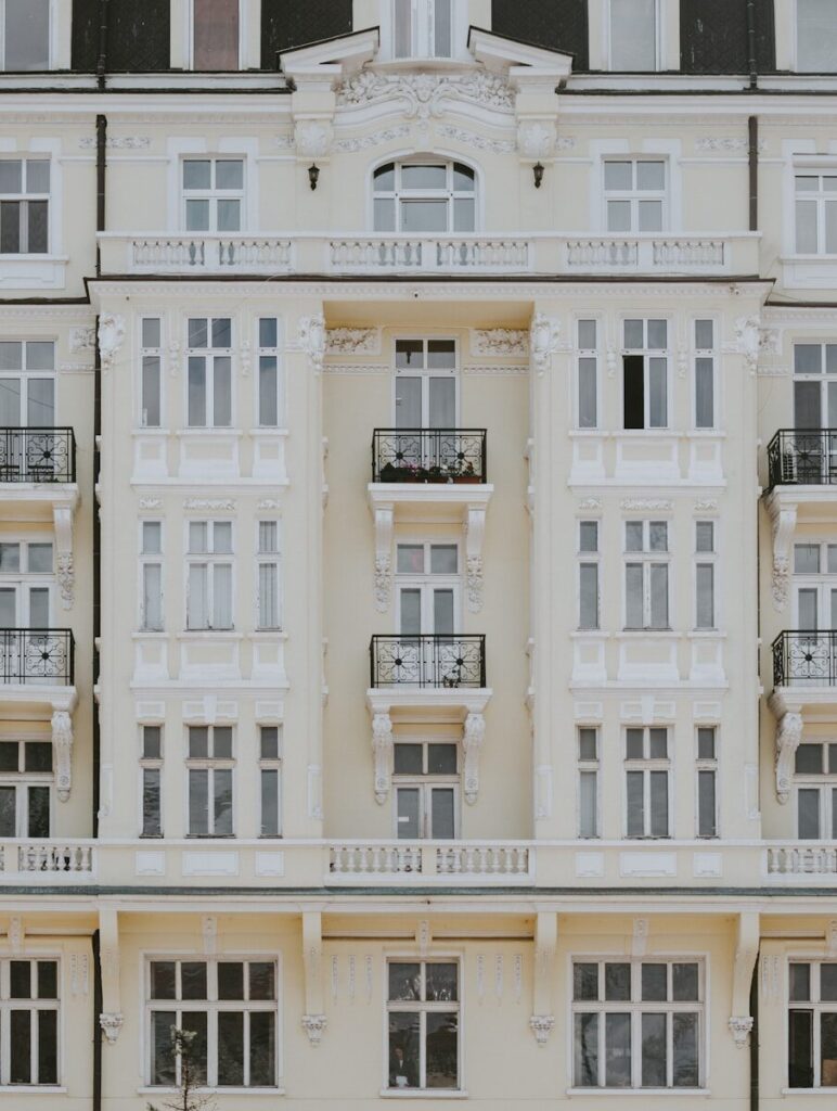 Ornate cream-colored building with many windows