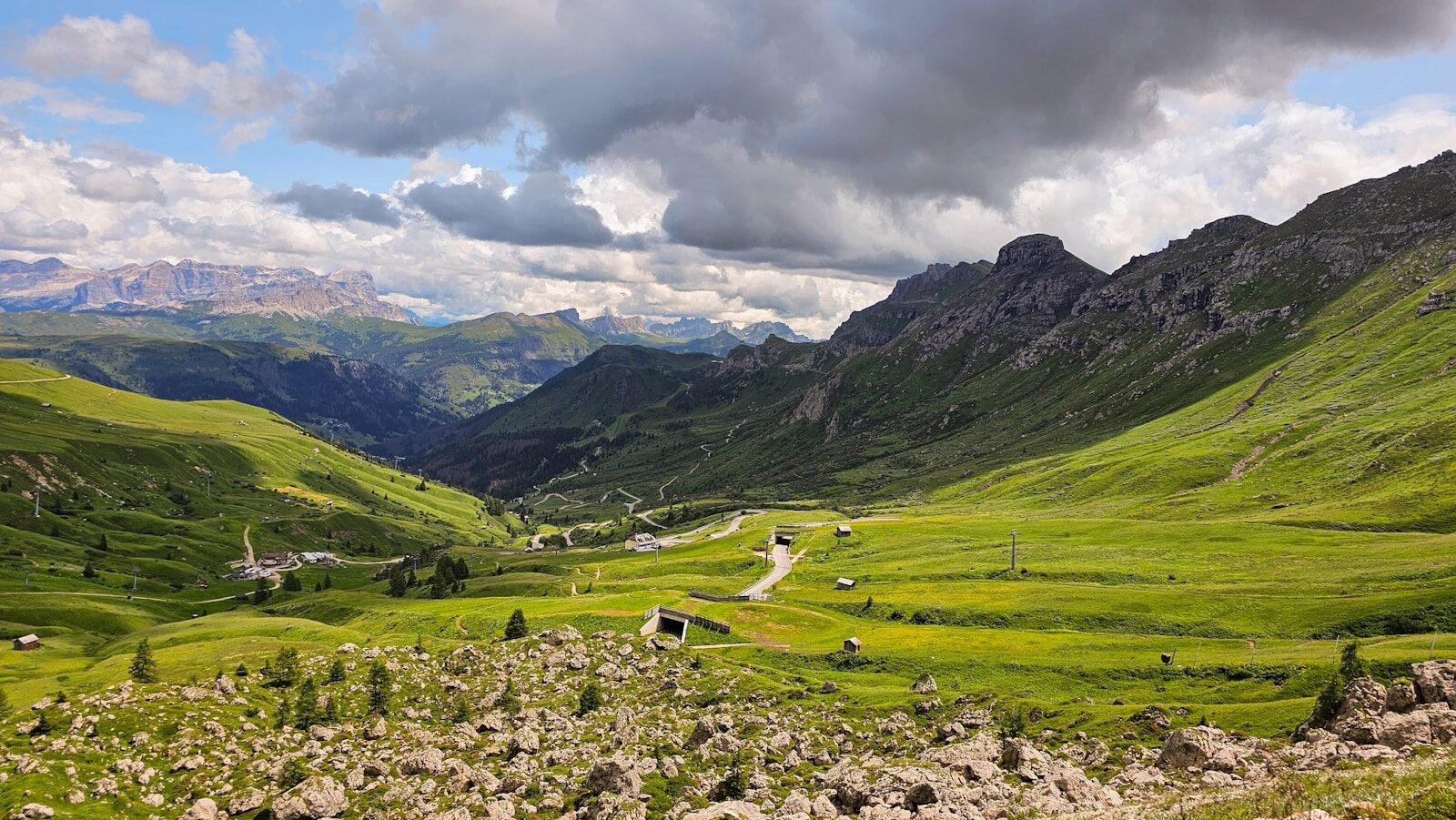 A green valley with mountains in the background